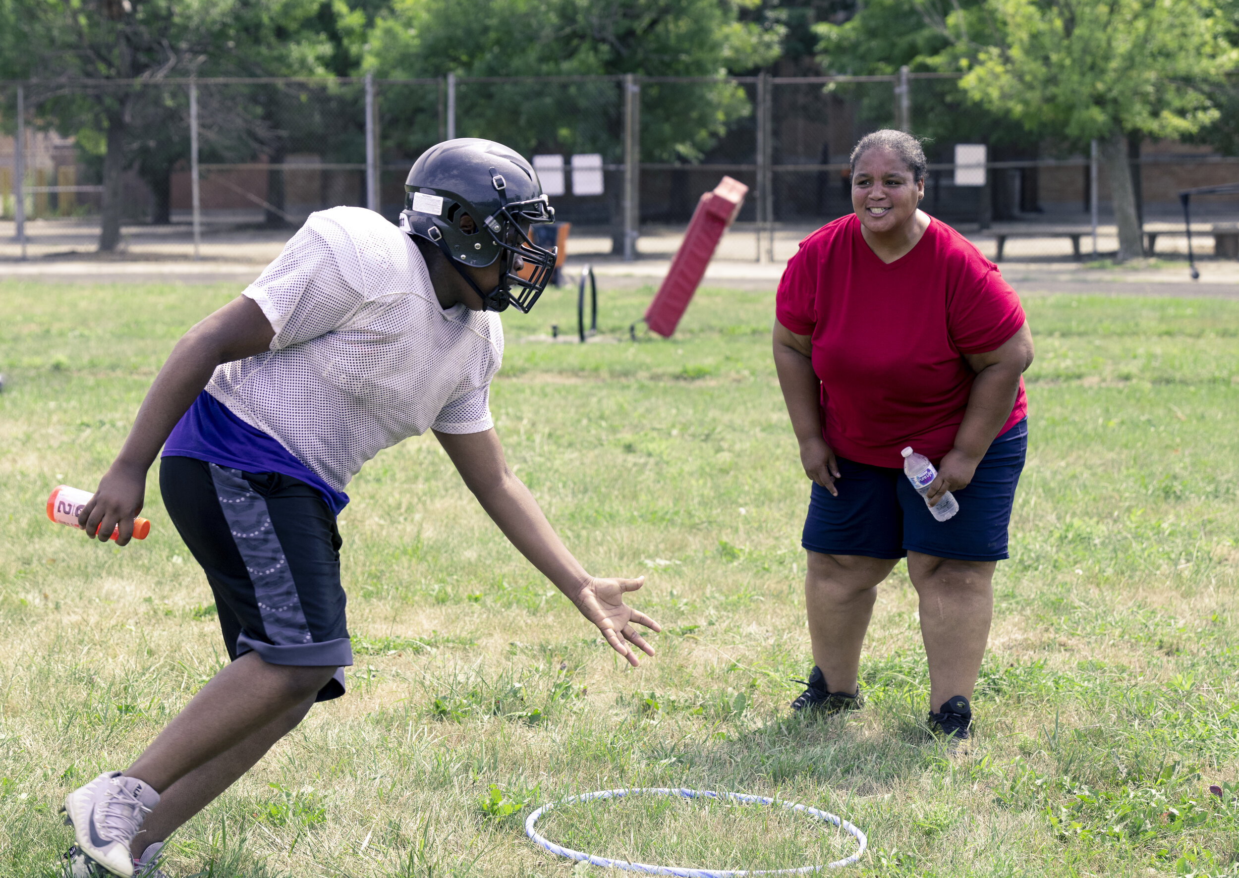 DuSable Head Coach Konesha Rhea puts one of her players through a drill during a recent practice at the South Side school. Rhea is the first female head coach in the history of the Chicago Public League. She is prepared to take on all the challenges that come with being a pioneer and hopes her story will inspire other women to coach traditional men’s sports.