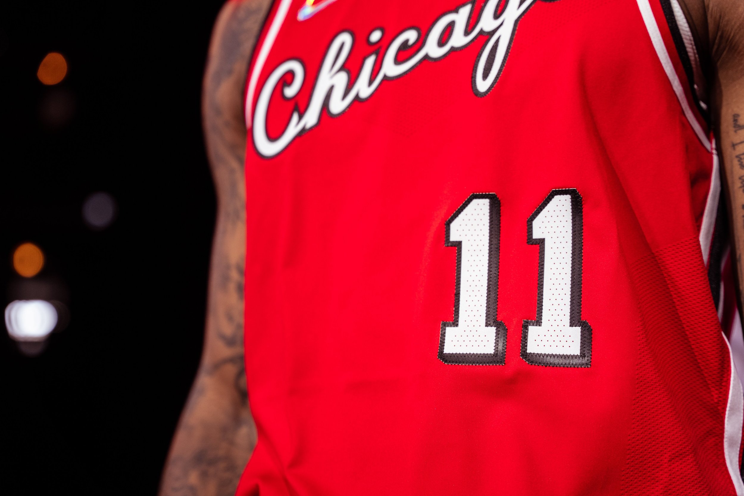 Close-up of a basketball jersey with the number 11 and the Chicago Bulls logo visible.