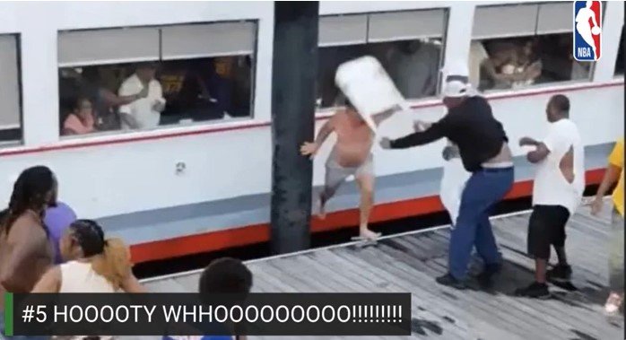 People on a dock trying to stop a train from hitting a person who fell onto the tracks, with a caption '#5 HOOOOTY WHOOOOOOOOO!!!!!!!'