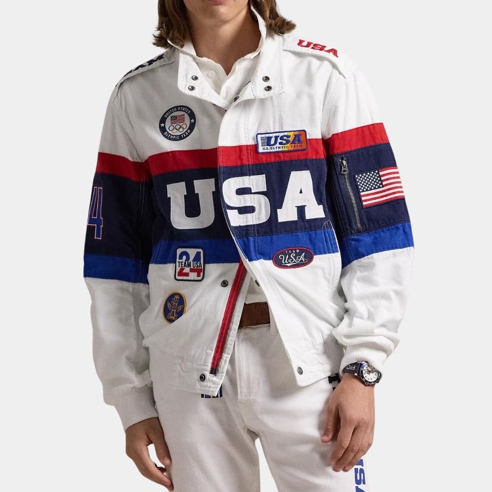Person wearing a patriotic USA-themed jacket with various patches, badges, and flags, and white pants.