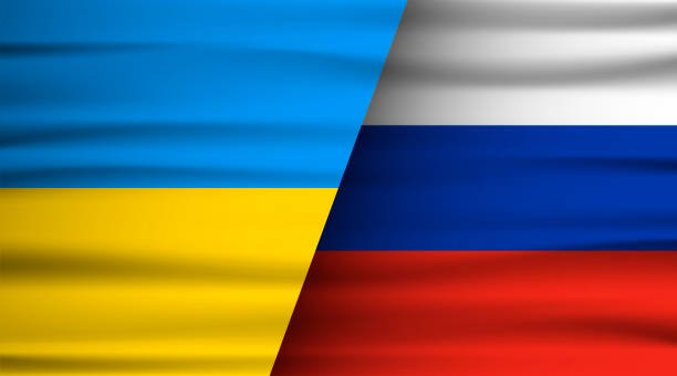 Image of the Ukrainian and Russian flags side by side.